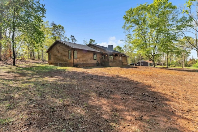 101 Owens Dr, Inman, SC 29349 - view of property exterior with a chimney, a metal roof, and crawl space
