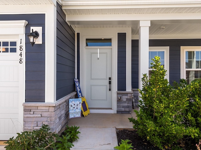 1848 Sourwood Dr, Woodruff, SC 29388 - doorway to property featuring covered porch and stone siding
