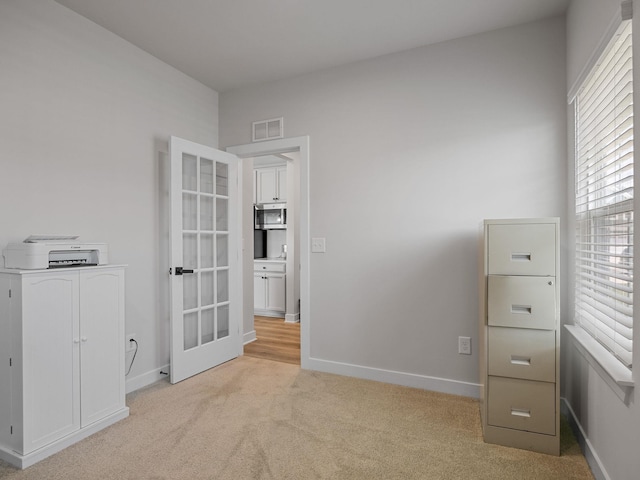 1848 Sourwood Dr, Woodruff, SC 29388 - unfurnished bedroom featuring light carpet and french doors
