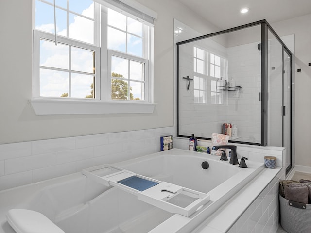 1848 Sourwood Dr, Woodruff, SC 29388 - bathroom featuring a garden tub, a shower stall, and recessed lighting