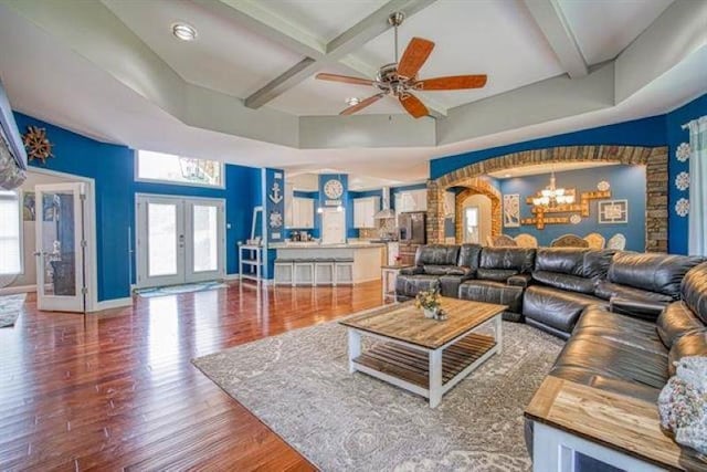 217 Aqua Cove Ct, Inman, SC 29349 - living room featuring a chandelier, coffered ceiling, wood finished floors, french doors, and beam ceiling
