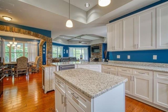 217 Aqua Cove Ct, Inman, SC 29349 - kitchen with light wood-type flooring, a peninsula, open floor plan, and white cabinetry