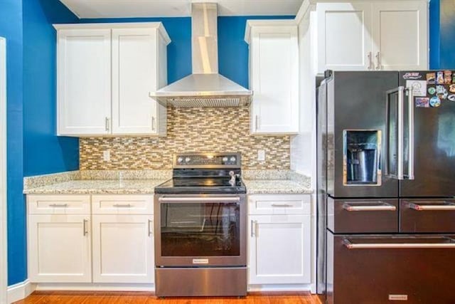 217 Aqua Cove Ct, Inman, SC 29349 - kitchen with refrigerator with ice dispenser, wall chimney exhaust hood, stainless steel electric range, white cabinets, and light stone countertops