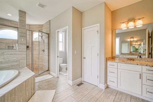 217 Aqua Cove Ct, Inman, SC 29349 - full bath with healthy amount of natural light, vanity, a bath, and a shower stall