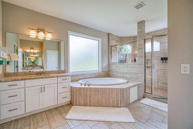 217 Aqua Cove Ct, Inman, SC 29349 - full bathroom featuring a garden tub, vanity, and a stall shower