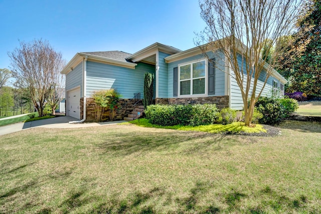 204 Lord Byron Ln, Travelers Rest, SC 29690 - view of front facade featuring a garage, a front yard, concrete driveway, and stone siding