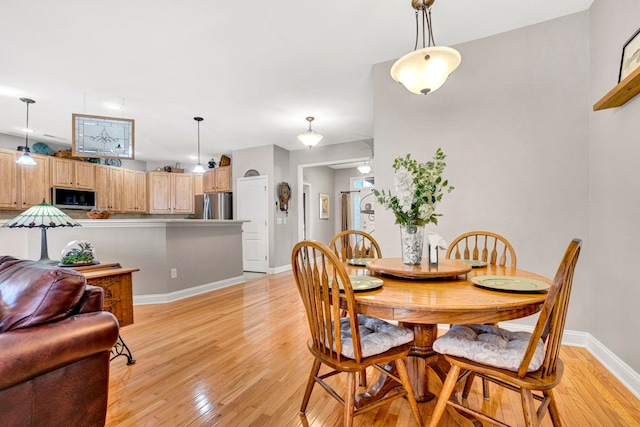 204 Lord Byron Ln, Travelers Rest, SC 29690 - dining area with light wood-type flooring and baseboards