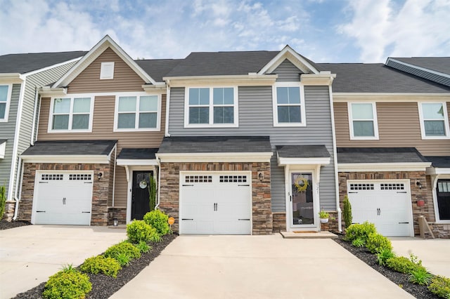 521 Preakness Run, Spartanburg, SC 29301 - view of property with stone siding, concrete driveway, and a garage