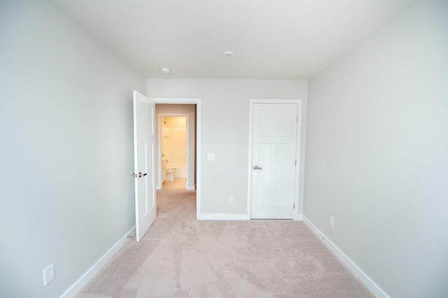 521 Preakness Run, Spartanburg, SC 29301 - unfurnished bedroom featuring baseboards and light colored carpet