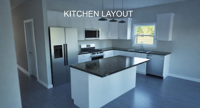2314 Wellington Rd, Spartanburg, SC 29302 - kitchen featuring appliances with stainless steel finishes, dark wood finished floors, white cabinetry, and a center island