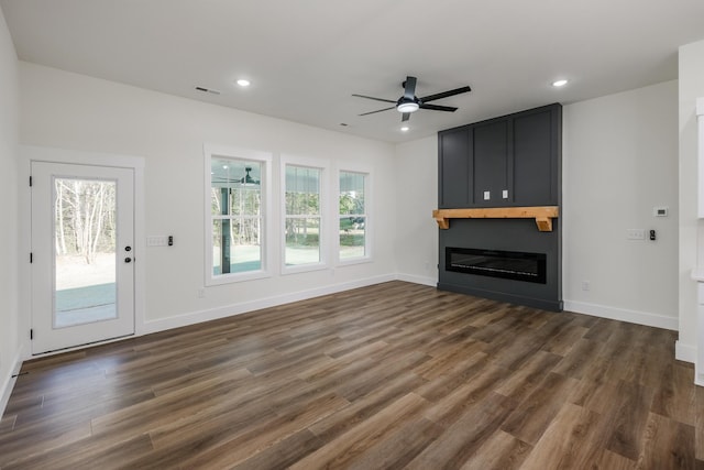 7 Campbell Mill Rd, Traveleres Rest, SC 29690 - unfurnished living room featuring ceiling fan, dark wood finished floors, a large fireplace, and recessed lighting