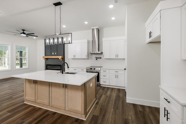 7 Campbell Mill Rd, Traveleres Rest, SC 29690 - kitchen with wall chimney range hood, stainless steel range with electric cooktop, dark wood-style floors, a ceiling fan, and light countertops