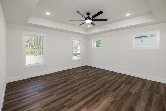 7 Campbell Mill Rd, Traveleres Rest, SC 29690 - empty room featuring a raised ceiling, dark wood-type flooring, a ceiling fan, and recessed lighting