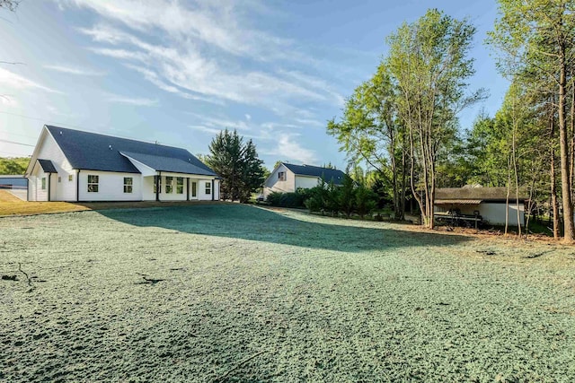 7 Campbell Mill Rd, Traveleres Rest, SC 29690 - rear view of house featuring a lawn