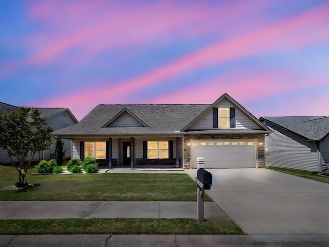 311 Hayfield Ct, Boiling Springs, SC 29316 - view of front of home featuring concrete driveway, a yard, covered porch, a garage, and roof with shingles