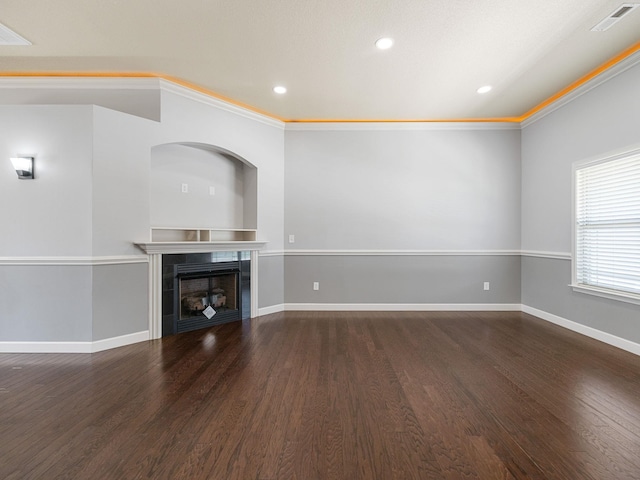 311 Hayfield Ct, Boiling Springs, SC 29316 - unfurnished living room with wood finished floors, a tiled fireplace, recessed lighting, and crown molding
