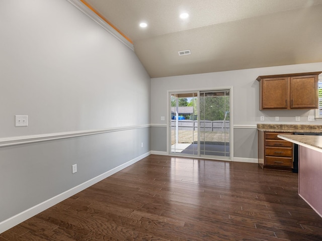 311 Hayfield Ct, Boiling Springs, SC 29316 - kitchen with lofted ceiling, brown cabinetry, dark wood finished floors, recessed lighting, and light countertops