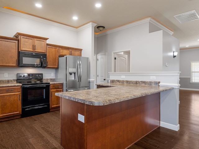 311 Hayfield Ct, Boiling Springs, SC 29316 - kitchen with black appliances, crown molding, brown cabinets, dark wood-type flooring, and recessed lighting