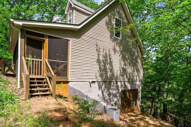 419 Hidden Hill Rd, Tryon, NC 28782 - view of side of home with a sunroom and a central AC unit