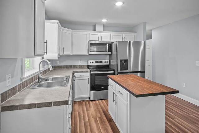 419 Hidden Hill Rd, Tryon, NC 28782 - kitchen featuring appliances with stainless steel finishes, wooden counters, white cabinets, dark wood-style floors, and recessed lighting