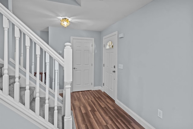 419 Hidden Hill Rd, Tryon, NC 28782 - entrance foyer with dark wood-style floors and stairway