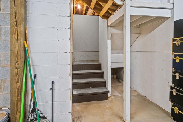 419 Hidden Hill Rd, Tryon, NC 28782 - unfinished below grade area featuring concrete block wall and stairs