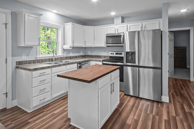 419 Hidden Hill Rd, Tryon, NC 28782 - kitchen with appliances with stainless steel finishes, wood counters, white cabinetry, dark wood finished floors, and recessed lighting