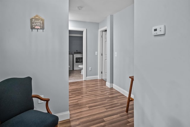 419 Hidden Hill Rd, Tryon, NC 28782 - hallway featuring wood finished floors and washer and dryer