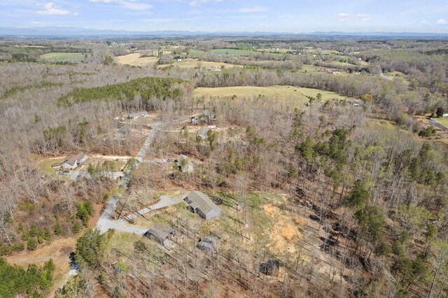 140 Vera Ln, Columbus, NC 28722 - aerial view of property and surrounding area with a heavily wooded area