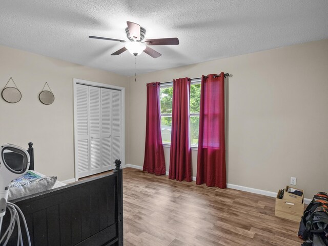 228 Anita Dr, Spartanburg, SC 29302 - bedroom featuring wood finished floors, a closet, a textured ceiling, and ceiling fan
