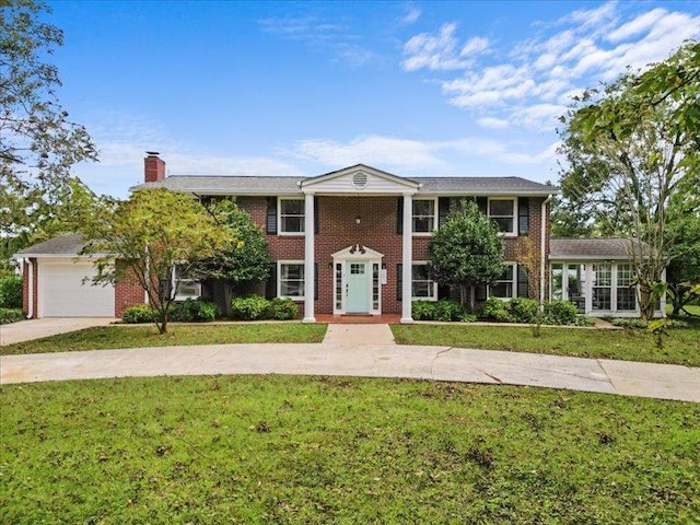 207 Bartlett St, Mauldin, SC 29662 - greek revival inspired property with a chimney, a front lawn, brick siding, and driveway