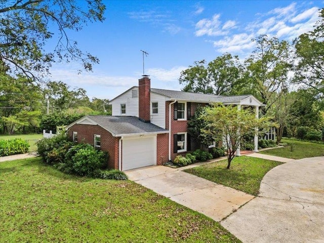 207 Bartlett St, Mauldin, SC 29662 - view of front of home with brick siding, an attached garage, a front lawn, a chimney, and driveway