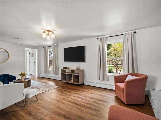 207 Bartlett St, Mauldin, SC 29662 - living room with baseboard heating, healthy amount of natural light, ornamental molding, and wood finished floors