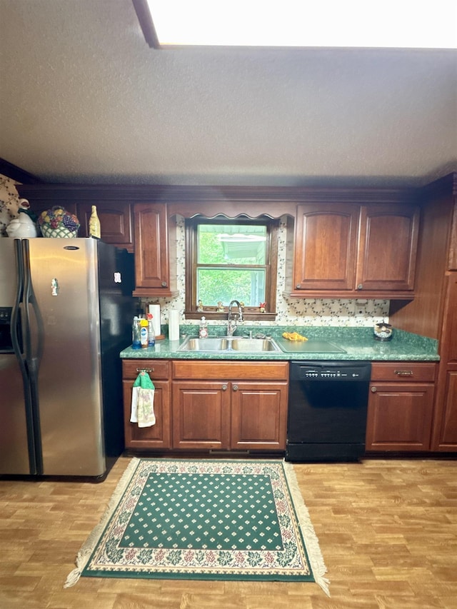 8627 Valley Falls Rd, Boiling Springs, SC 29316 - kitchen with dishwasher, stainless steel fridge, light wood-style floors, brown cabinets, and a textured ceiling