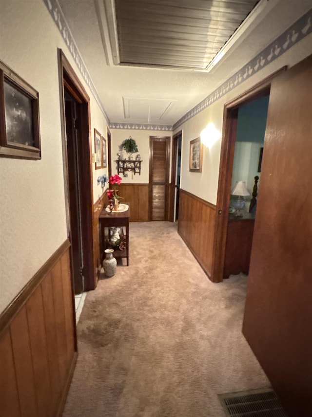 8627 Valley Falls Rd, Boiling Springs, SC 29316 - corridor with a wainscoted wall, attic access, wooden walls, and carpet flooring