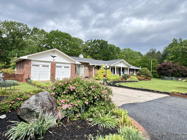 8627 Valley Falls Rd, Boiling Springs, SC 29316 - ranch-style home with driveway, an attached garage, a front yard, and brick siding