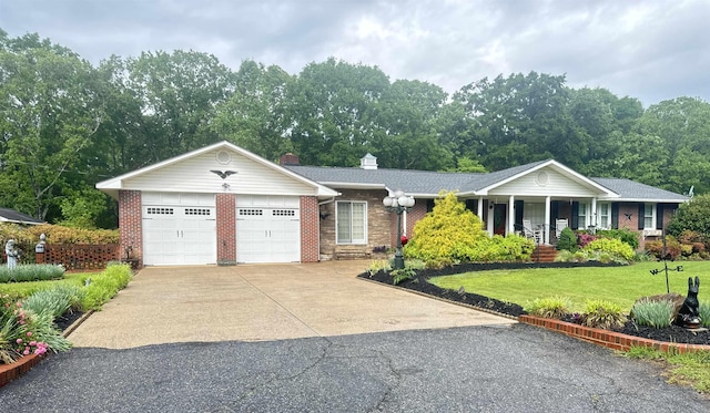 8627 Valley Falls Rd, Boiling Springs, SC 29316 - ranch-style house with brick siding, an attached garage, a front yard, concrete driveway, and covered porch