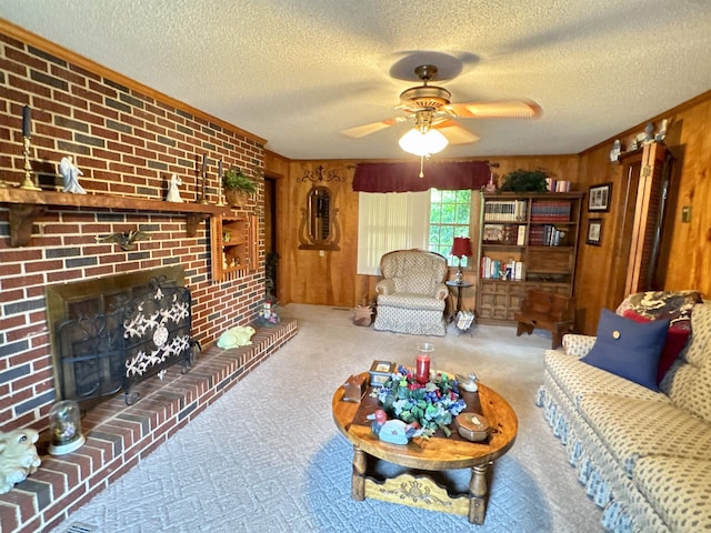 8627 Valley Falls Rd, Boiling Springs, SC 29316 - carpeted living area with wooden walls, ceiling fan, a textured ceiling, and a fireplace
