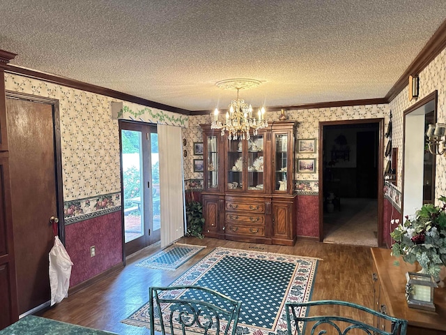 8627 Valley Falls Rd, Boiling Springs, SC 29316 - dining area featuring wallpapered walls, wood finished floors, a chandelier, crown molding, and a textured ceiling