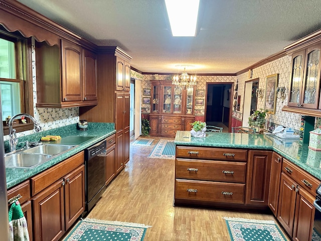 8627 Valley Falls Rd, Boiling Springs, SC 29316 - kitchen with black dishwasher, a chandelier, crown molding, light wood-style flooring, and a peninsula