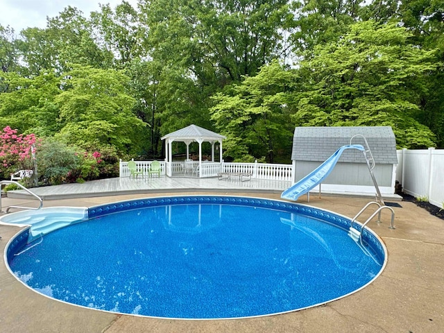 8627 Valley Falls Rd, Boiling Springs, SC 29316 - view of swimming pool with a gazebo, a water slide, and view of wooded area