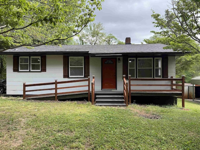 7 Pine Ln, Inman, SC 29349 - ranch-style house with a front yard, a shingled roof, and a chimney