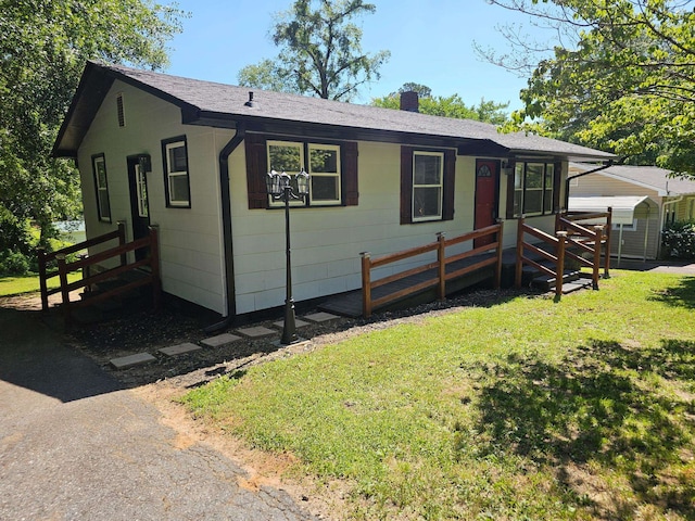 7 Pine Ln, Inman, SC 29349 - view of front of property with a chimney, roof with shingles, and a front lawn