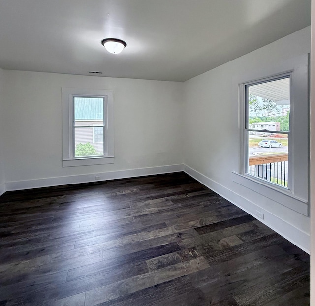 306 Manning St, Spartanburg, SC 29304 - spare room featuring dark wood finished floors and baseboards