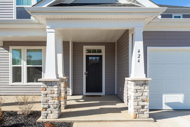 424 Granbury Dr, Duncan, SC 29334 - doorway to property with covered porch and a garage