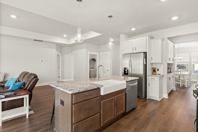 424 Granbury Dr, Duncan, SC 29334 - kitchen with appliances with stainless steel finishes, dark wood-style floors, white cabinetry, recessed lighting, and a kitchen island with sink