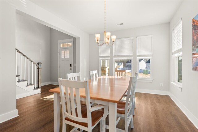 424 Granbury Dr, Duncan, SC 29334 - dining space featuring a chandelier, healthy amount of natural light, wood finished floors, and stairway