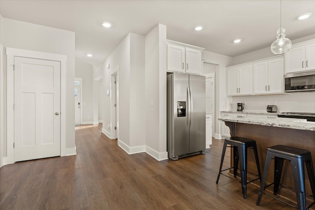 424 Granbury Dr, Duncan, SC 29334 - kitchen with stainless steel appliances, white cabinetry, dark wood-type flooring, and recessed lighting