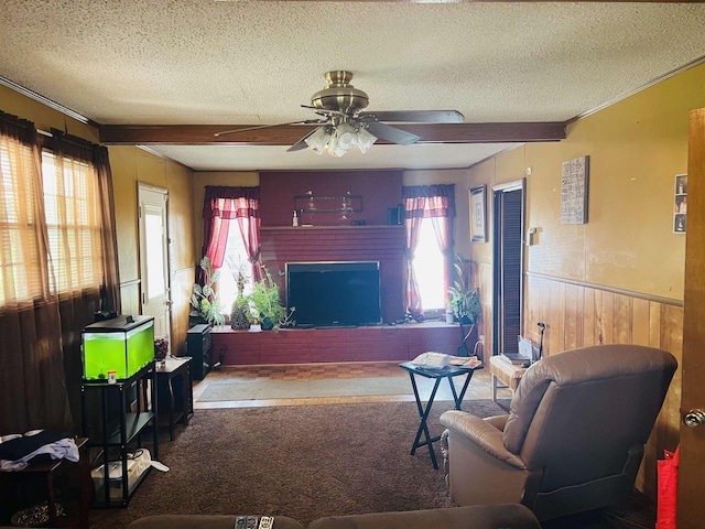 209 Demos Dr, Roebuck, SC 29376 - living room with a textured ceiling, a ceiling fan, ornamental molding, wooden walls, and wainscoting