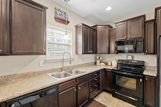 212 Dayside Ct, Greer, SC 29651 - kitchen with black appliances, dark brown cabinetry, light countertops, and pendant lighting